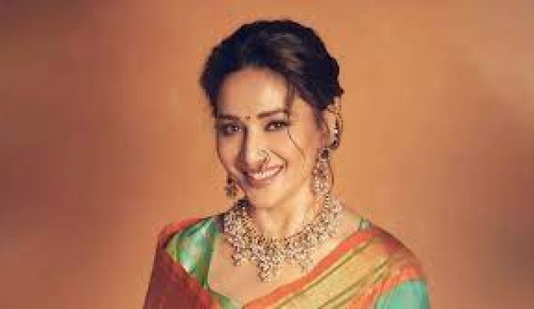 Madhuri Dixit Stuns in a Blue Sari and Traditional Maharashtrian Nath at Prestigious Awards Ceremony