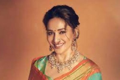 Madhuri Dixit Stuns in a Blue Sari and Traditional Maharashtrian Nath at Prestigious Awards Ceremony